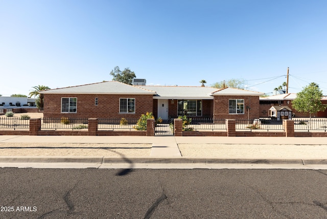 1330 E Monte Vista Rd, Phoenix, AZ 85006 - ranch-style home with a fenced front yard and brick siding