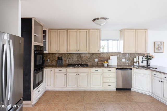 1330 E Monte Vista Rd, Phoenix, AZ 85006 - kitchen with stainless steel appliances, a sink, backsplash, and cream cabinets