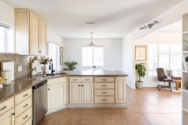 1330 E Monte Vista Rd, Phoenix, AZ 85006 - kitchen with stainless steel dishwasher, a peninsula, a sink, light tile patterned floors, and cream cabinets