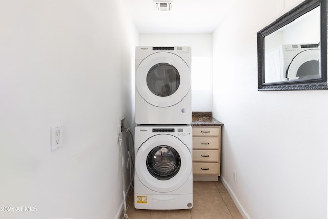 1330 E Monte Vista Rd, Phoenix, AZ 85006 - washroom featuring stacked washer / drying machine, light tile patterned floors, and baseboards