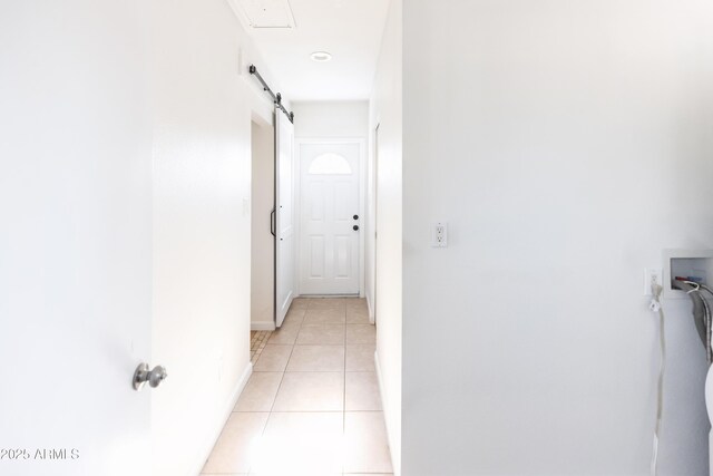 1330 E Monte Vista Rd, Phoenix, AZ 85006 - hallway with light tile patterned floors, baseboards, and a barn door