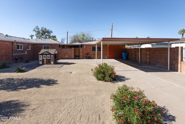 1330 E Monte Vista Rd, Phoenix, AZ 85006 - rear view of property with a carport, fence, driveway, and brick siding
