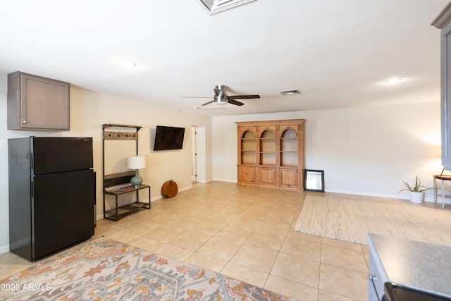 1330 E Monte Vista Rd, Phoenix, AZ 85006 - unfurnished living room with a ceiling fan, light tile patterned floors, baseboards, and recessed lighting