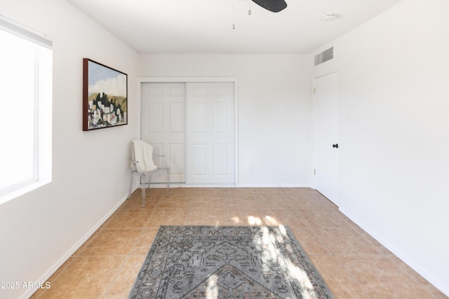 1330 E Monte Vista Rd, Phoenix, AZ 85006 - unfurnished bedroom featuring tile patterned flooring, a closet, baseboards, and ceiling fan
