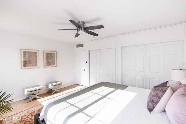 1330 E Monte Vista Rd, Phoenix, AZ 85006 - bedroom featuring a ceiling fan, multiple closets, and light tile patterned floors