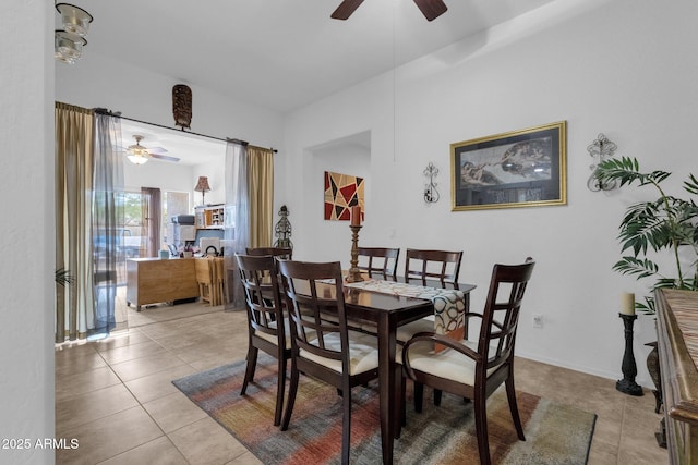 dining area featuring light tile patterned floors and ceiling fan