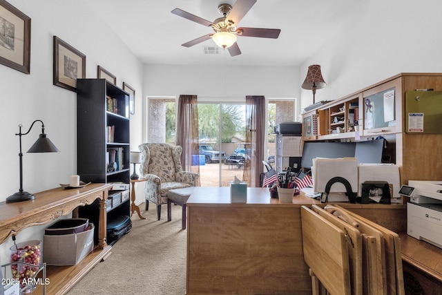 office area featuring light carpet and ceiling fan