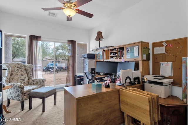 carpeted office with ceiling fan