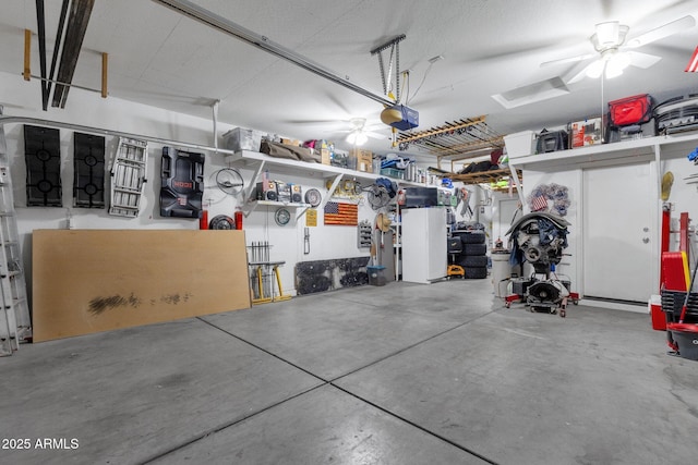 garage with ceiling fan and a garage door opener