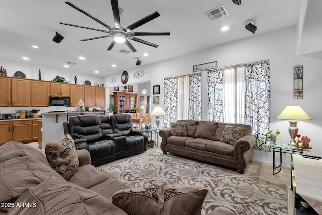 living room featuring ceiling fan