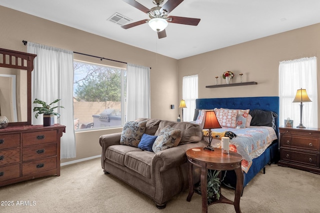 carpeted bedroom with ceiling fan