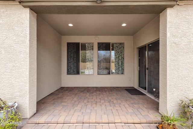 entrance to property with a patio