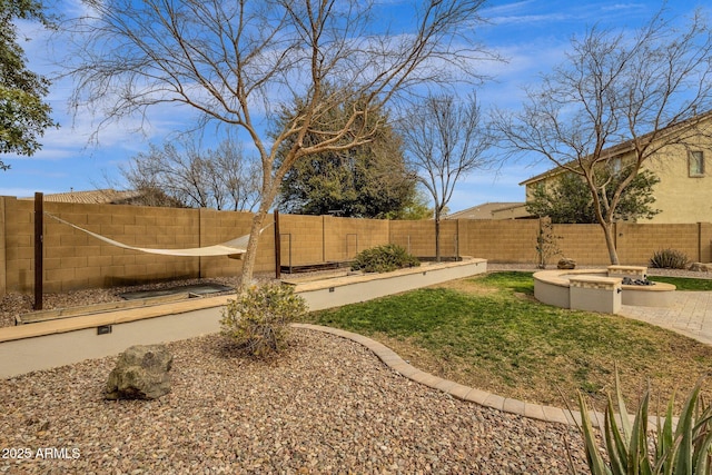 view of yard with a fire pit and a patio area