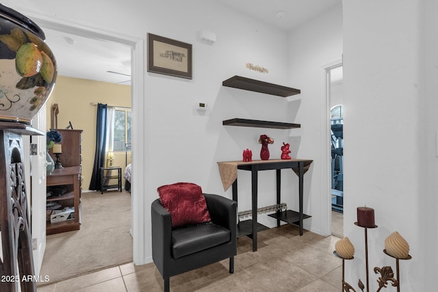 sitting room with light tile patterned floors