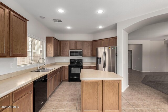 18719 E Pelican Ct, Queen Creek, AZ 85142 - kitchen featuring black appliances, a sink, a kitchen island, light countertops, and recessed lighting