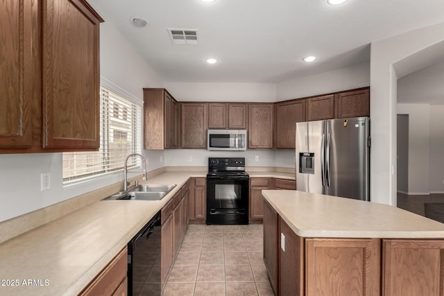 18719 E Pelican Ct, Queen Creek, AZ 85142 - kitchen featuring black appliances, a sink, light countertops, recessed lighting, and light tile patterned floors