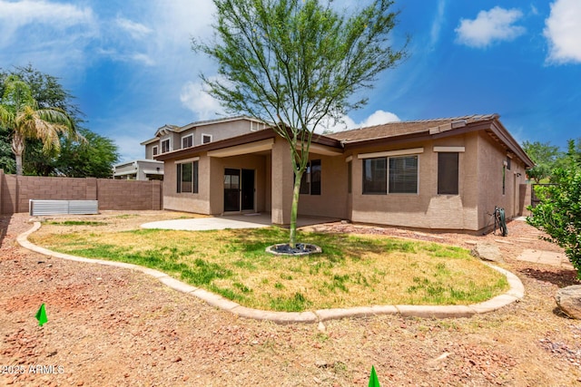 18719 E Pelican Ct, Queen Creek, AZ 85142 - rear view of property with stucco siding, a fenced backyard, and a patio
