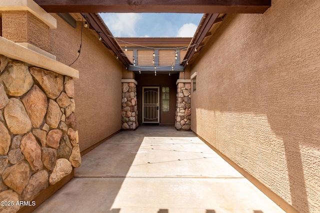 18719 E Pelican Ct, Queen Creek, AZ 85142 - doorway to property with stucco siding and stone siding