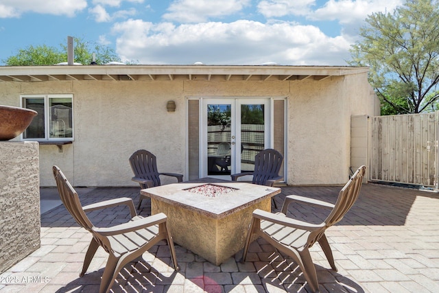 7734 E Rose Ln, Scottsdale, AZ 85250 - view of patio featuring an outdoor fire pit and fence