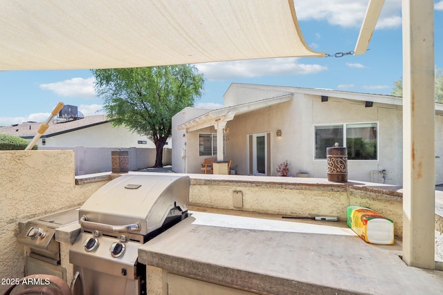 7734 E Rose Ln, Scottsdale, AZ 85250 - view of front facade featuring a patio, stucco siding, and fence