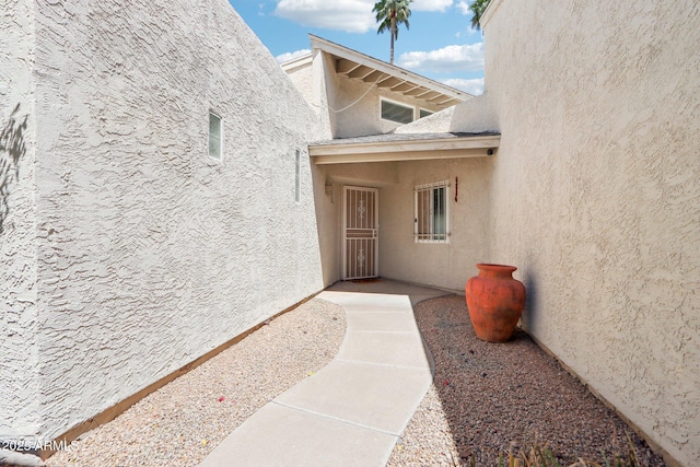 7734 E Rose Ln, Scottsdale, AZ 85250 - doorway to property featuring stucco siding