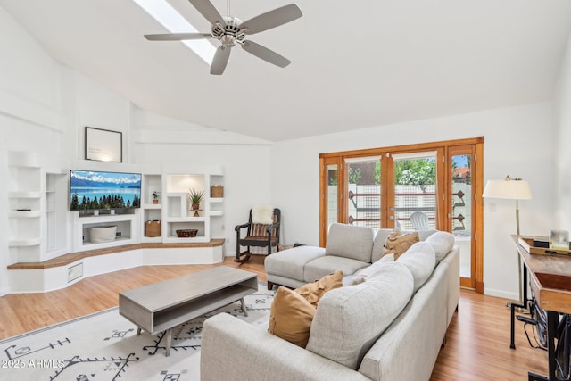 7734 E Rose Ln, Scottsdale, AZ 85250 - living room featuring high vaulted ceiling, a ceiling fan, built in features, and wood finished floors