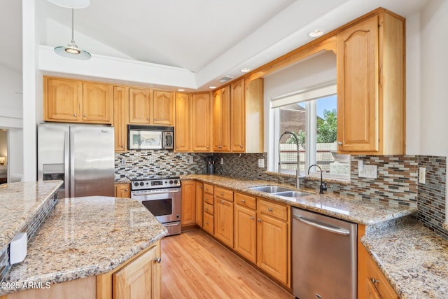 7734 E Rose Ln, Scottsdale, AZ 85250 - kitchen with a sink, light wood-style floors, lofted ceiling, light stone countertops, and appliances with stainless steel finishes