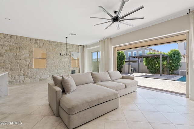 living room with ceiling fan and light tile patterned floors