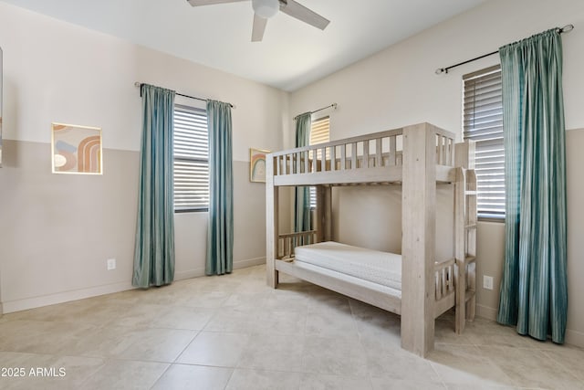 bedroom featuring light tile patterned floors and ceiling fan