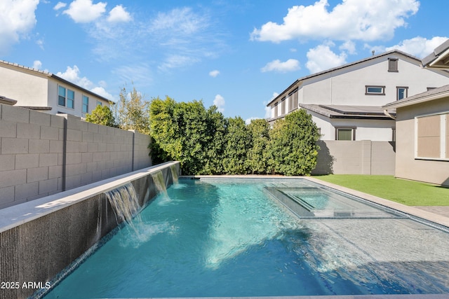 view of swimming pool with pool water feature and an in ground hot tub