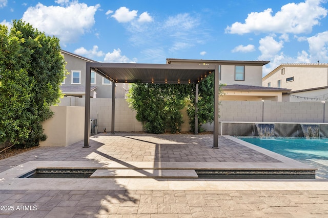 view of patio / terrace with pool water feature and a fenced in pool