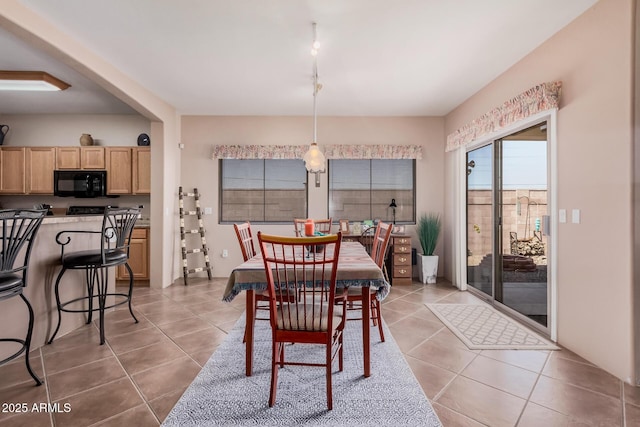 dining space with light tile patterned floors