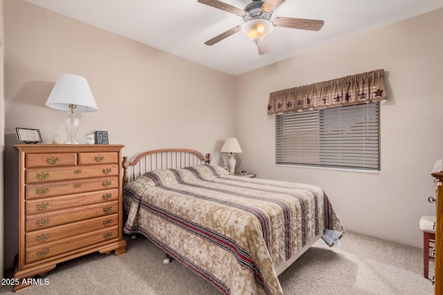 carpeted bedroom with a ceiling fan