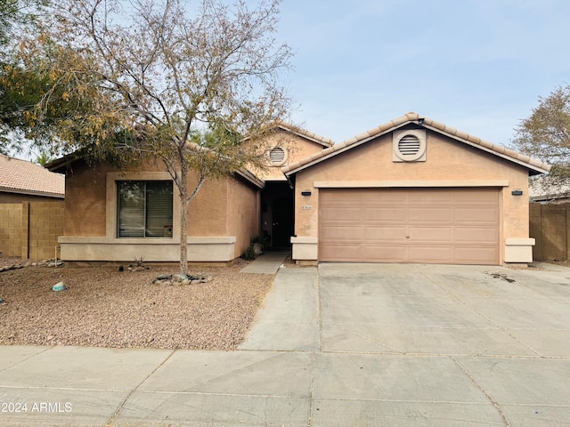 ranch-style home featuring a garage