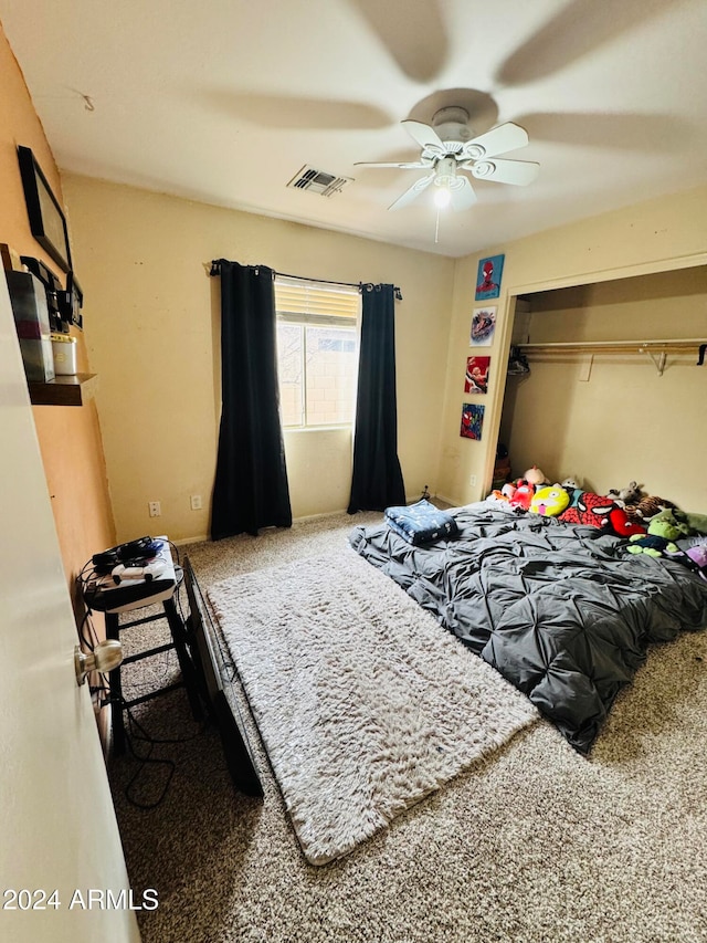 bedroom featuring ceiling fan, a closet, and carpet floors