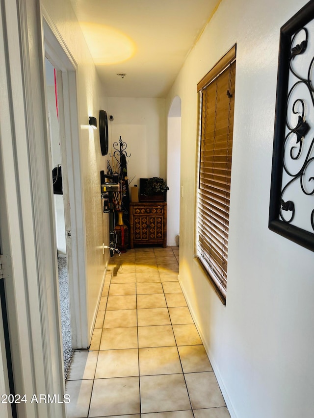 corridor with light tile patterned flooring