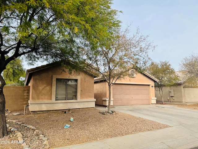 ranch-style house featuring a garage