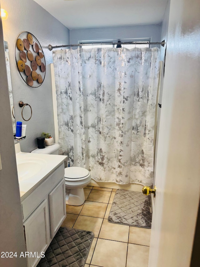 bathroom with tile patterned floors, vanity, and toilet