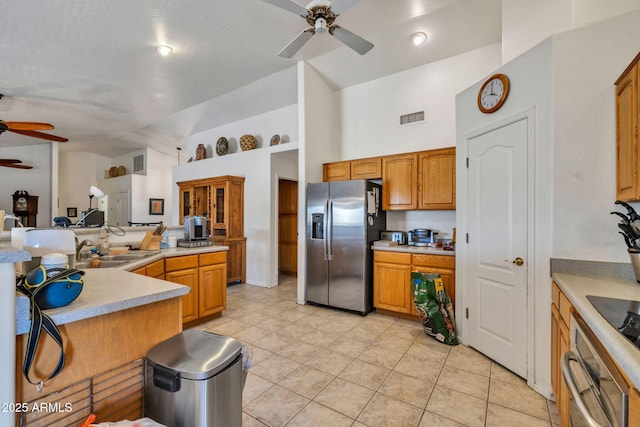 22201 E Vallejo St, Queen Creek, AZ 85142 - kitchen featuring a ceiling fan, stainless steel appliances, high vaulted ceiling, light tile patterned flooring, and light countertops