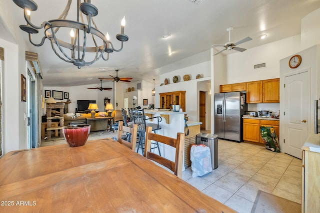 22201 E Vallejo St, Queen Creek, AZ 85142 - dining area featuring ceiling fan, a chandelier, and light tile patterned floors