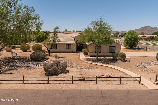 22201 E Vallejo St, Queen Creek, AZ 85142 - view of front of home featuring a tiled roof, stucco siding, and a mountain view