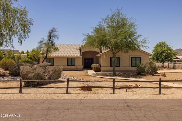 22201 E Vallejo St, Queen Creek, AZ 85142 - view of front facade featuring a fenced front yard, stucco siding, and a tile roof