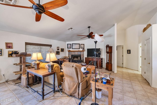 22201 E Vallejo St, Queen Creek, AZ 85142 - living area with ceiling fan, a tile fireplace, light tile patterned floors, and high vaulted ceiling