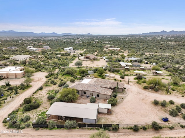 birds eye view of property featuring a mountain view