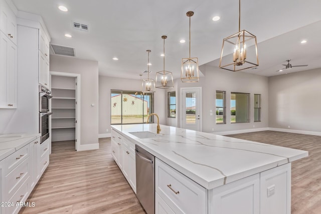 1229 N 106th Pl, Mesa, AZ 85207 - kitchen featuring a sink, appliances with stainless steel finishes, baseboards, a chandelier, and light wood-type flooring