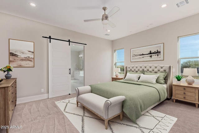 1229 N 106th Pl, Mesa, AZ 85207 - bedroom featuring a barn door, light colored carpet, multiple windows, recessed lighting, and ensuite bathroom
