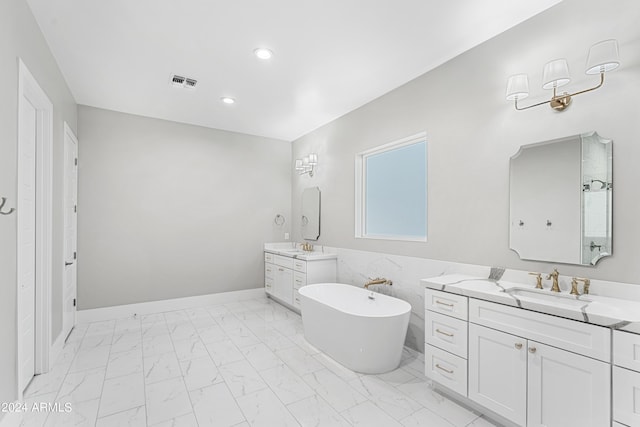 1229 N 106th Pl, Mesa, AZ 85207 - full bath featuring marble finish floors, a soaking tub, two vanities, recessed lighting, and baseboards