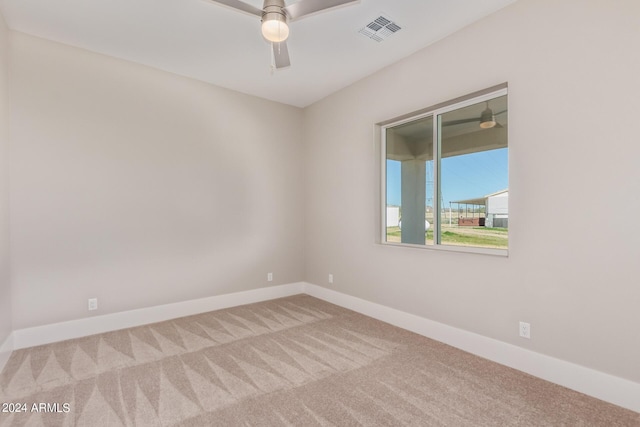 1229 N 106th Pl, Mesa, AZ 85207 - spare room featuring carpet, a ceiling fan, and baseboards