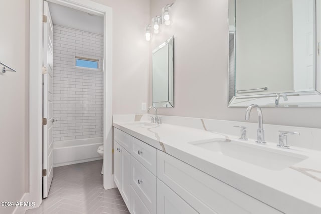 1229 N 106th Pl, Mesa, AZ 85207 - bathroom featuring toilet, double vanity, and bathtub / shower combination