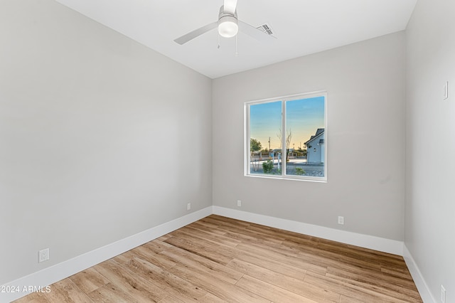1229 N 106th Pl, Mesa, AZ 85207 - spare room with wood finished floors, baseboards, and ceiling fan